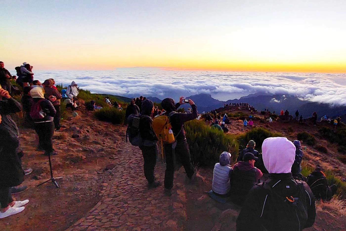 Tourists watching the sunrise at Pico do Arieiro